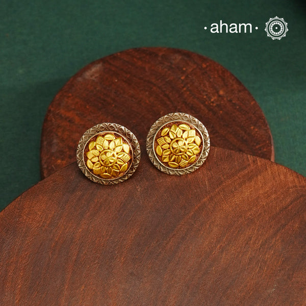 Enhance your style with the timeless elegance of the Dual Tone Silver Earrings. Handcrafted by skilled karigars in Barmer, Rajasthan, this earring features traditional Bandhel work, where a thin sheet of hand beaten 22 carat gold is fused with 92.5 silver and then set on 92.5 silver using a unique wax filling technique. A classic representation of Indian craftsmanship.