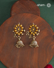 Enhance your style with the timeless elegance of the Dual Tone Silver Earrings. Handcrafted by skilled karigars in Barmer, Rajasthan, this earring features traditional Bandhel work, where a thin sheet of hand beaten 22 carat gold is fused with 92.5 silver and then set on 92.5 silver using a unique wax filling technique. A classic representation of Indian craftsmanship.