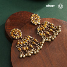 Enhance your style with the timeless elegance of the Dual Tone Silver Earrings. Handcrafted by skilled karigars in Barmer, Rajasthan, this earring features traditional Bandhel work, where a thin sheet of hand beaten 22 carat gold is fused with 92.5 silver and then set on 92.5 silver using a unique wax filling technique. A classic representation of Indian craftsmanship.