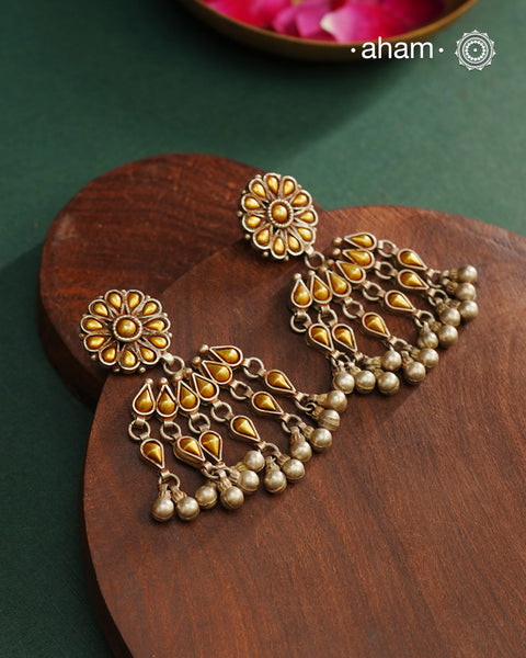 Enhance your style with the timeless elegance of the Dual Tone Silver Earrings. Handcrafted by skilled karigars in Barmer, Rajasthan, this earring features traditional Bandhel work, where a thin sheet of hand beaten 22 carat gold is fused with 92.5 silver and then set on 92.5 silver using a unique wax filling technique. A classic representation of Indian craftsmanship.