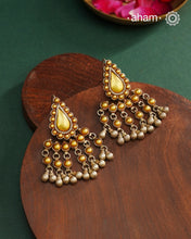 Enhance your style with the timeless elegance of the Dual Tone Silver Earrings. Handcrafted by skilled karigars in Barmer, Rajasthan, this earring features traditional Bandhel work, where a thin sheet of hand beaten&nbsp;22 carat gold is fused with 92.5 silver and then set on 92.5 silver using a unique wax filling technique. A classic representation of Indian craftsmanship.
