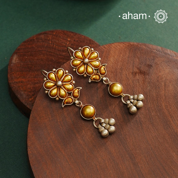 Enhance your style with the timeless elegance of the Dual Tone Silver Earrings. Handcrafted by skilled karigars in Barmer, Rajasthan, this earring features traditional Bandhel work, where a thin sheet of hand beaten 22 carat gold is fused with 92.5 silver and then set on 92.5 silver using a unique wax filling technique. A classic representation of Indian craftsmanship.
