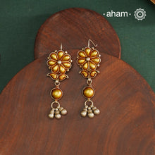 Enhance your style with the timeless elegance of the Dual Tone Silver Earrings. Handcrafted by skilled karigars in Barmer, Rajasthan, this earring features traditional Bandhel work, where a thin sheet of hand beaten 22 carat gold is fused with 92.5 silver and then set on 92.5 silver using a unique wax filling technique. A classic representation of Indian craftsmanship.