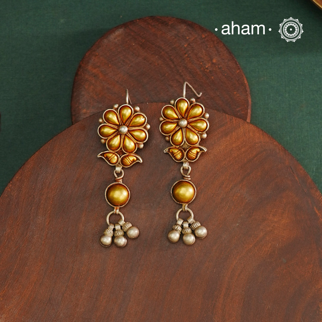 Enhance your style with the timeless elegance of the Dual Tone Silver Earrings. Handcrafted by skilled karigars in Barmer, Rajasthan, this earring features traditional Bandhel work, where a thin sheet of hand beaten 22 carat gold is fused with 92.5 silver and then set on 92.5 silver using a unique wax filling technique. A classic representation of Indian craftsmanship.