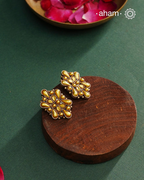 Enhance your style with the timeless elegance of the Dual Tone Silver Earrings. Handcrafted by skilled karigars in Barmer, Rajasthan, this earring features traditional Bandhel work, where a thin sheet of hand beaten 22 carat gold is fused with 92.5 silver and then set on 92.5 silver using a unique wax filling technique. A classic representation of Indian craftsmanship.