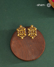 Enhance your style with the timeless elegance of the Dual Tone Silver Earrings. Handcrafted by skilled karigars in Barmer, Rajasthan, this earring features traditional Bandhel work, where a thin sheet of hand beaten 22 carat gold is fused with 92.5 silver and then set on 92.5 silver using a unique wax filling technique. A classic representation of Indian craftsmanship.