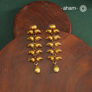 Enhance your style with the timeless elegance of the Dual Tone Silver Earrings. Handcrafted by skilled karigars in Barmer, Rajasthan, this earring features traditional Bandhel work, where a thin sheet of hand beaten 22 carat gold is fused with 92.5 silver and then set on 92.5 silver using a unique wax filling technique. A classic representation of Indian craftsmanship.