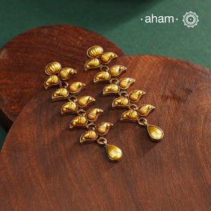 Enhance your style with the timeless elegance of the Dual Tone Silver Earrings. Handcrafted by skilled karigars in Barmer, Rajasthan, this earring features traditional Bandhel work, where a thin sheet of hand beaten 22 carat gold is fused with 92.5 silver and then set on 92.5 silver using a unique wax filling technique. A classic representation of Indian craftsmanship.