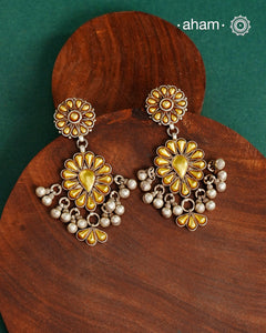 Enhance your style with the timeless elegance of the Dual Tone Silver Earrings. Handcrafted by skilled karigars in Barmer, Rajasthan, this earring features traditional Bandhel work, where a thin sheet of hand beaten 22 carat gold is fused with 92.5 silver and then set on 92.5 silver using a unique wax filling technique. A classic representation of Indian craftsmanship.