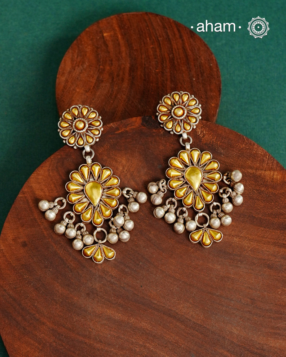 Enhance your style with the timeless elegance of the Dual Tone Silver Earrings. Handcrafted by skilled karigars in Barmer, Rajasthan, this earring features traditional Bandhel work, where a thin sheet of hand beaten 22 carat gold is fused with 92.5 silver and then set on 92.5 silver using a unique wax filling technique. A classic representation of Indian craftsmanship.