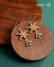Enhance your style with the timeless elegance of the Dual Tone Silver Earrings. Handcrafted by skilled karigars in Barmer, Rajasthan, this earring features traditional Bandhel work, where a thin sheet of hand beaten 22 carat gold is fused with 92.5 silver and then set on 92.5 silver using a unique wax filling technique. A classic representation of Indian craftsmanship.
