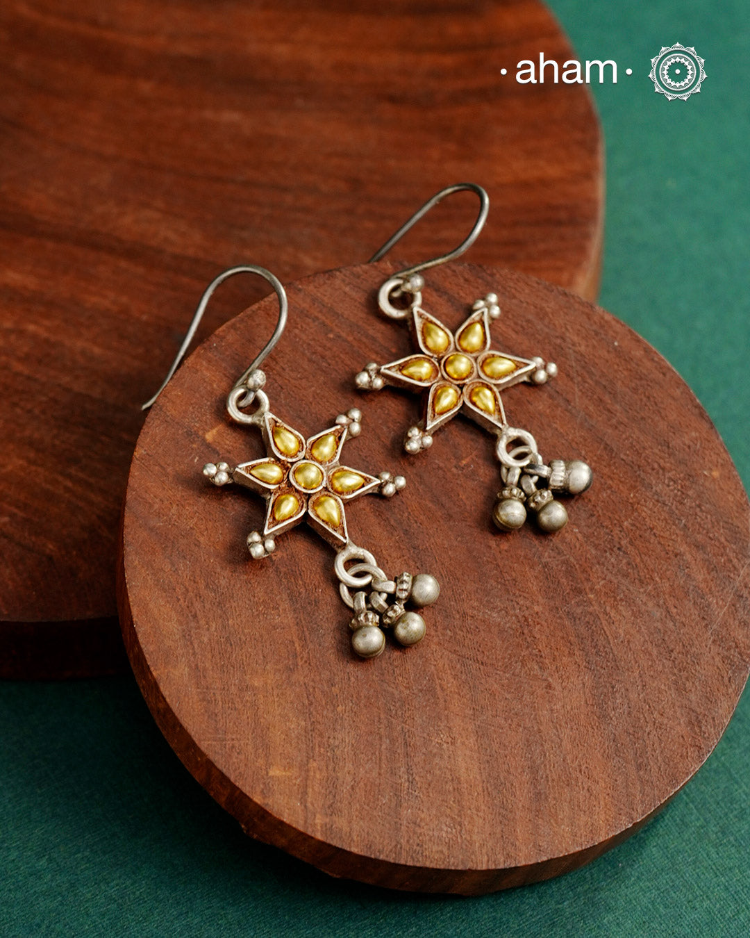 Enhance your style with the timeless elegance of the Dual Tone Silver Earrings. Handcrafted by skilled karigars in Barmer, Rajasthan, this earring features traditional Bandhel work, where a thin sheet of hand beaten 22 carat gold is fused with 92.5 silver and then set on 92.5 silver using a unique wax filling technique. A classic representation of Indian craftsmanship.
