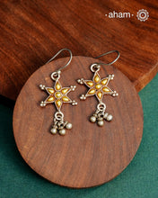 Enhance your style with the timeless elegance of the Dual Tone Silver Earrings. Handcrafted by skilled karigars in Barmer, Rajasthan, this earring features traditional Bandhel work, where a thin sheet of hand beaten 22 carat gold is fused with 92.5 silver and then set on 92.5 silver using a unique wax filling technique. A classic representation of Indian craftsmanship.