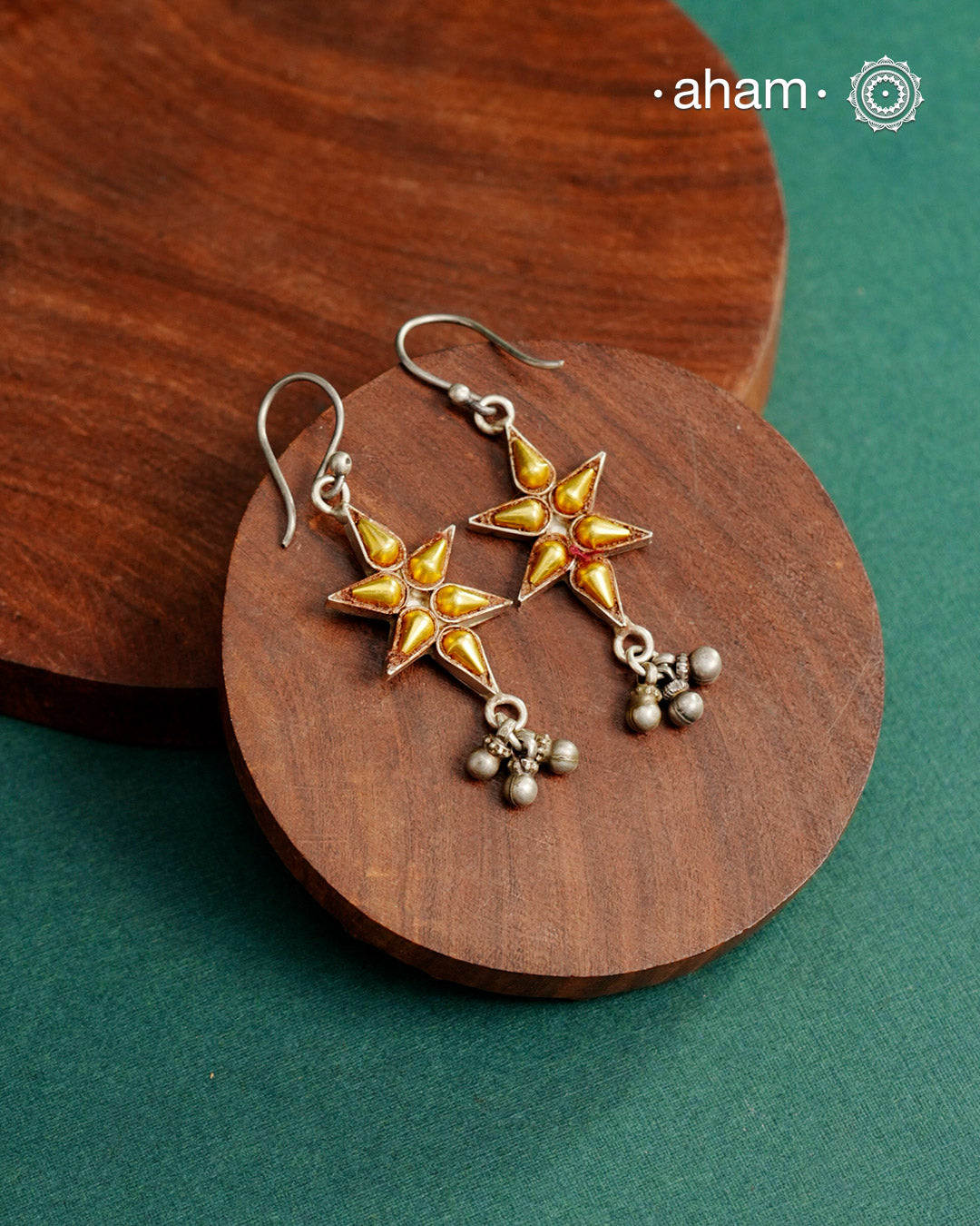 Enhance your style with the timeless elegance of the Dual Tone Silver Earrings. Handcrafted by skilled karigars in Barmer, Rajasthan, this earring features traditional Bandhel work, where a thin sheet of hand beaten 22 carat gold is fused with 92.5 silver and then set on 92.5 silver using a unique wax filling technique. A classic representation of Indian craftsmanship