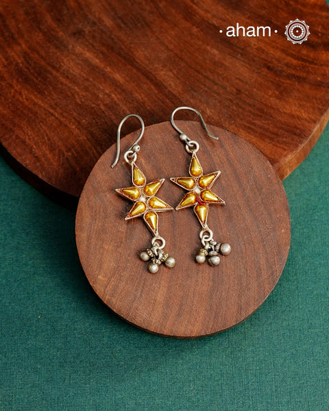 Enhance your style with the timeless elegance of the Dual Tone Silver Earrings. Handcrafted by skilled karigars in Barmer, Rajasthan, this earring features traditional Bandhel work, where a thin sheet of hand beaten 22 carat gold is fused with 92.5 silver and then set on 92.5 silver using a unique wax filling technique. A classic representation of Indian craftsmanship