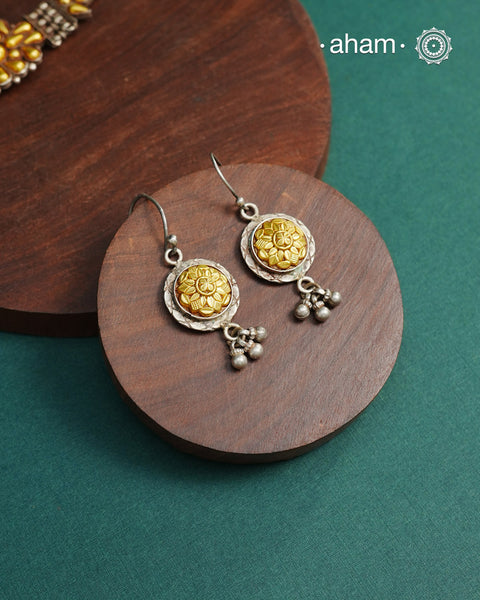 Enhance your style with the timeless elegance of the Dual Tone Silver Earrings. Handcrafted by skilled karigars in Barmer, Rajasthan, this earring features traditional Bandhel work, where a thin sheet of hand beaten 22 carat gold is fused with 92.5 silver and then set on 92.5 silver using a unique wax filling technique. A classic representation of Indian craftsmanship.