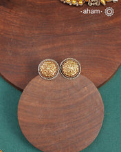 Enhance your style with the timeless elegance of the Dual Tone Silver Earrings. Handcrafted by skilled karigars in Barmer, Rajasthan, this earring features traditional Bandhel work, where a thin sheet of hand beaten 22 carat gold is fused with 92.5 silver and then set on 92.5 silver using a unique wax filling technique. A classic representation of Indian craftsmanship.