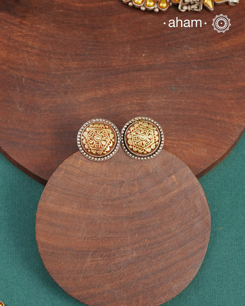 Enhance your style with the timeless elegance of the Dual Tone Silver Earrings. Handcrafted by skilled karigars in Barmer, Rajasthan, this earring features traditional Bandhel work, where a thin sheet of hand beaten 22 carat gold is fused with 92.5 silver and then set on 92.5 silver using a unique wax filling technique. A classic representation of Indian craftsmanship.