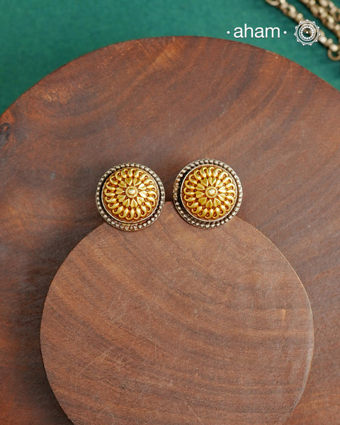 Enhance your style with the timeless elegance of the Dual Tone Silver Earrings. Handcrafted by skilled karigars in Barmer, Rajasthan, this earring features traditional Bandhel work, where a thin sheet of hand beaten 22 carat gold is fused with 92.5 silver and then set on 92.5 silver using a unique wax filling technique. A classic representation of Indian craftsmanship.