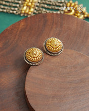 Enhance your style with the timeless elegance of the Dual Tone Silver Earrings. Handcrafted by skilled karigars in Barmer, Rajasthan, this earring features traditional Bandhel work, where a thin sheet of hand beaten 22 carat gold is fused with 92.5 silver and then set on 92.5 silver using a unique wax filling technique. A classic representation of Indian craftsmanship.