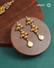 Enhance your style with the timeless elegance of the Dual Tone Silver Earrings. Handcrafted by skilled karigars in Barmer, Rajasthan, this earring features traditional Bandhel work, where a thin sheet of hand beaten 22 carat gold is fused with 92.5 silver and then set on 92.5 silver using a unique wax filling technique. A classic representation of Indian craftsmanship.