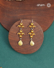 Enhance your style with the timeless elegance of the Dual Tone Silver Earrings. Handcrafted by skilled karigars in Barmer, Rajasthan, this earring features traditional Bandhel work, where a thin sheet of hand beaten 22 carat gold is fused with 92.5 silver and then set on 92.5 silver using a unique wax filling technique. A classic representation of Indian craftsmanship.