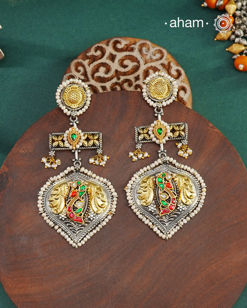 Noori two tone earrings handcrafted in 92.5 sterling silver with kundan and gold highlights.Style this up with your favourite ethnic or fusion outfits to complete the look.