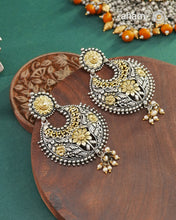 Noori two tone Chandbali earrings handcrafted in 92.5 sterling silver with gold highlights.Style this up with your favourite ethnic or fusion outfits to complete the look.