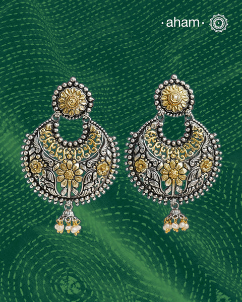 Noori two tone Chandbali earrings handcrafted in 92.5 sterling silver with gold highlights.&nbsp;Style this up with your favourite ethnic or fusion outfits to complete the look.