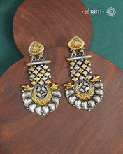 Noori two tone Earrings handcrafted in 92.5 sterling silver with gold highlights.Style this up with your favourite ethnic or fusion outfits to complete the look.