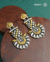 Noori two tone Earrings handcrafted in 92.5 sterling silver with gold highlights.Style this up with your favourite ethnic or fusion outfits to complete the look.