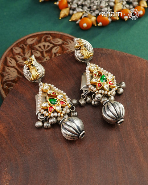 Noori two tone Earrings handcrafted in 92.5 sterling silver with kundan and gold highlights.Style this up with your favourite ethnic or fusion outfits to complete the look.