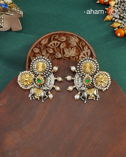 Noori two tone cow Earrings, handcrafted in 92.5 sterling silver with kundan and gold highlights.Style this up with your favourite ethnic or fusion outfits to complete the look.
