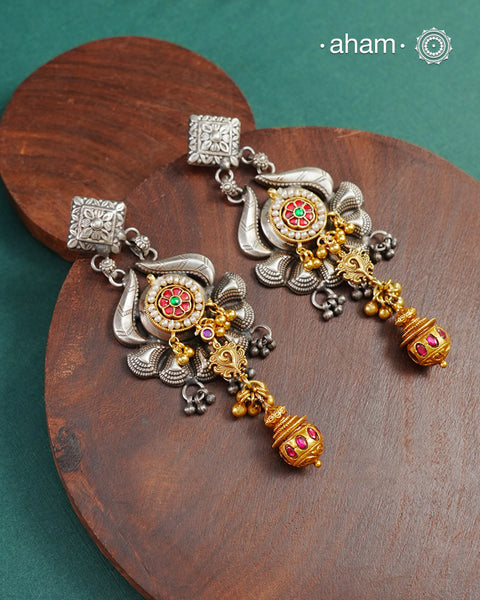 Noori two tone earrings handcrafted in 92.5 sterling silver with kundan and gold highlights.Style this up with your favourite ethnic or fusion outfits to complete the look.