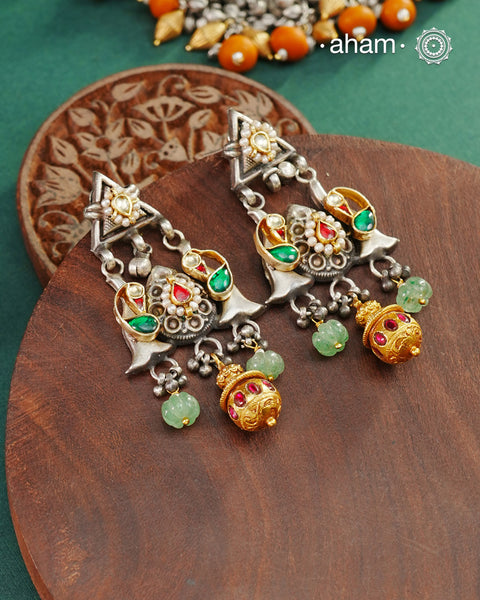 Noori two tone Earrings handcrafted in 92.5 sterling silver with kundan and gold highlights.Style this up with your favourite ethnic or fusion outfits to complete the look.