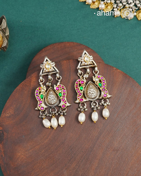Noori two tone Earrings. The earrings are handcrafted in 92.5 sterling silver with kundan and gold highlights.&nbsp;Style this up with your favourite ethnic or fusion outfits to complete the look.