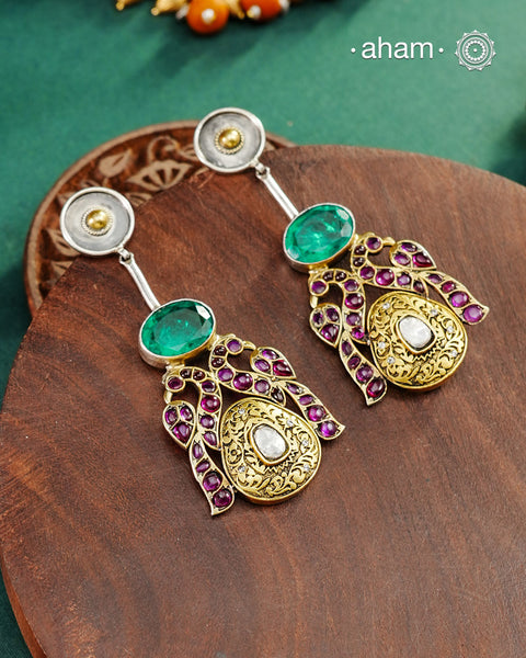 Noori two tone Earrings handcrafted in 92.5 sterling silver with kundan and gold highlights.Style this up with your favourite ethnic or fusion outfits to complete the look.