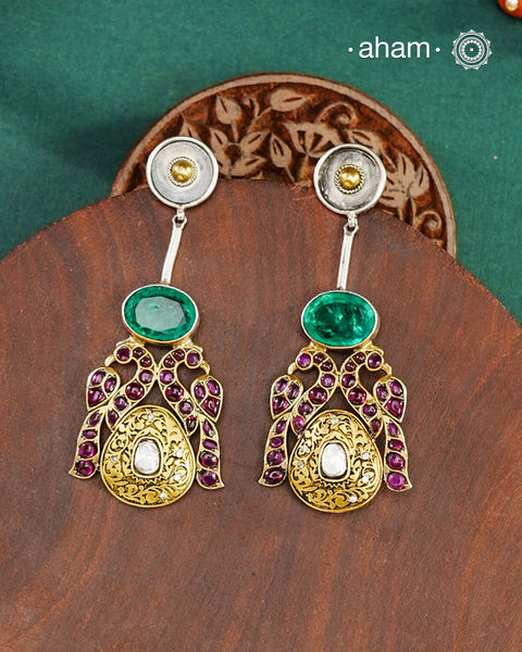 Noori two tone Earrings handcrafted in 92.5 sterling silver with kundan and gold highlights.Style this up with your favourite ethnic or fusion outfits to complete the look.