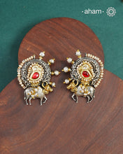 Noori two tone earrings handcrafted in 92.5 sterling silver with kundan and gold highlights. Style this up with your favourite ethnic or fusion outfits to complete the look.