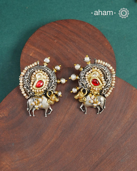 Noori two tone earrings handcrafted in 92.5 sterling silver with kundan and gold highlights. Style this up with your favourite ethnic or fusion outfits to complete the look.