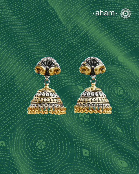 Noori two tone jhumkie handcrafted in 92.5 sterling silver with gold highlights. Style this up with your favourite ethnic or fusion outfits to complete the look.