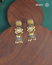 Noori two tone earrings handcrafted in 92.5 sterling silver with kundan and gold highlights.Style this up with your favourite ethnic or fusion outfits to complete the look.