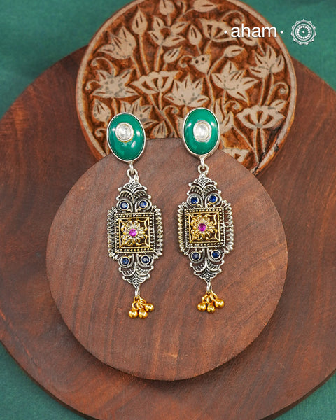 Noori two tone Earrings handcrafted in 92.5 sterling silver with kundan and gold highlights.Style this up with your favourite ethnic or fusion outfits to complete the look.