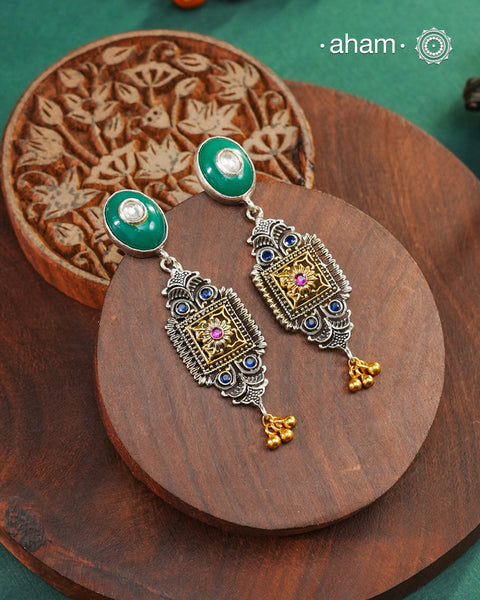 Noori two tone Earrings handcrafted in 92.5 sterling silver with kundan and gold highlights.Style this up with your favourite ethnic or fusion outfits to complete the look.