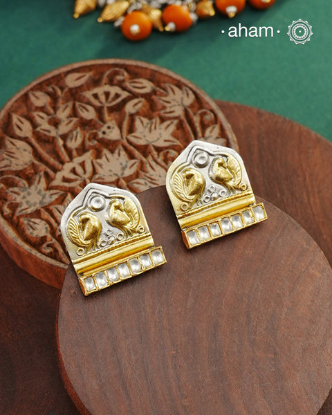 Noori two tone Earrings handcrafted in 92.5 sterling silver with kundan and gold highlights.Style this up with your favourite ethnic or fusion outfits to complete the look.