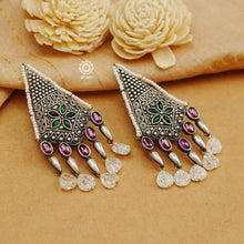 Handcrafted 92.5 sterling Silver earring from our Malhar collection.  hand silver work, with kemp stone highlights and laced with pearls 