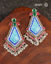 This Meena Work Festive Silver earrings is a stunning piece of jewellery perfect for special occasions. It features a combination of kundan and pearls with very contemporary enamelling work all crafted in 92.5 silver.