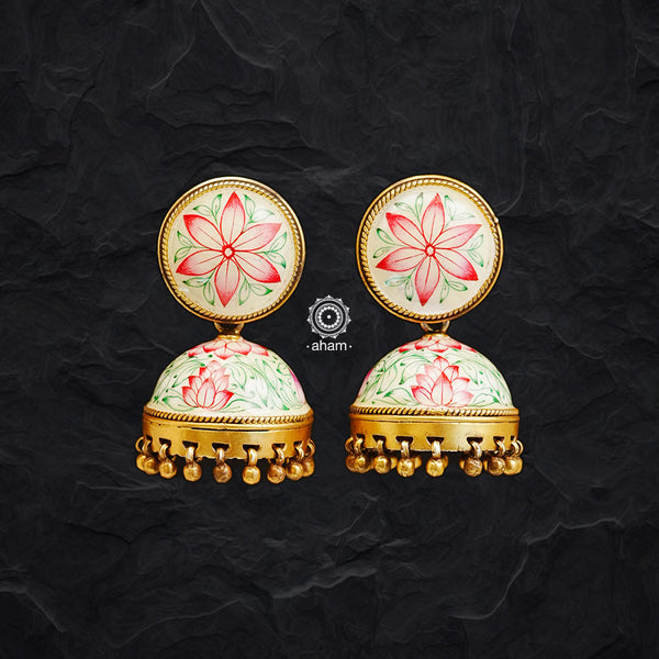 Uniquely crafted gold polish jhumkie with intricate handpainted Meenakari work. Handcrafted by skilful artisans in 92.5 sterling silver. Perfect pair of glossy earrings with your daily and festive looks.