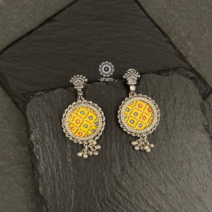 Delicate silver drop earrings masterfully hand-painted with a detailed miniature floral design and enclosed in a glass top. Light weight, colourful and Ideal for everyday wear.