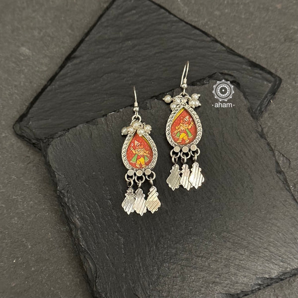 Light weight 92.5 silver earrings with intricate miniature hand painted lord Ganesha motif in vibrant colours, enclosed with a glass top.